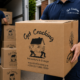 Get Cracking furniture movers Dublin carrying a moving box