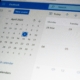 Outlook calendar showing April 2022 in month view with a highlighted date and left navigation icons, plus a blue event button at top left.